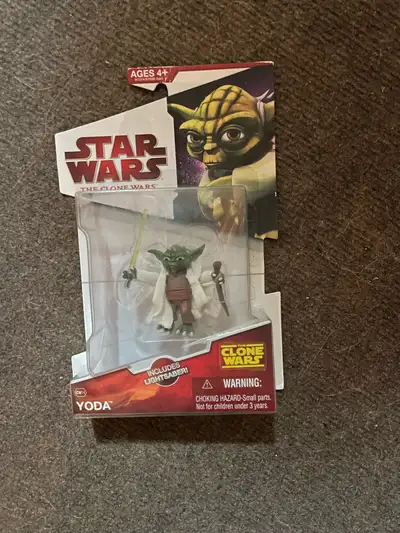 This brand new, factory-sealed Star Wars The Clone Wars Yoda action figure features the iconic Jedi...