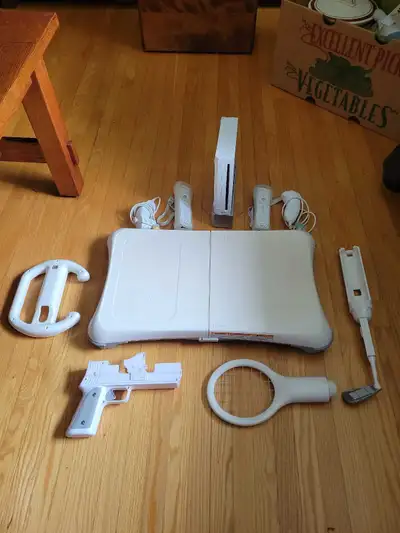 Complete Nintendo Wii console bundle. Has a Wii console, Wii Fit Balance Board, two Wii Remotes, two...