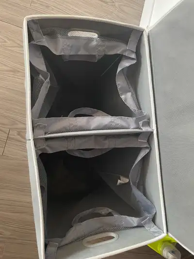 Fabric laundry basket. Gray colour. Two dividers. Measurements HxWxL (57cm x 34cm x 58cm / 22.4in x...