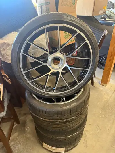 Offering a set of 4 Porsche center lock rims mounted on Pirelli tires, sized 305/30 ZR20. These rims...