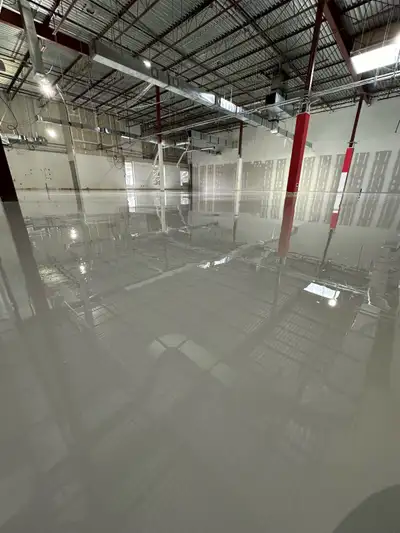 Transform your space with our professional epoxy and concrete coating services. As seen in the image...