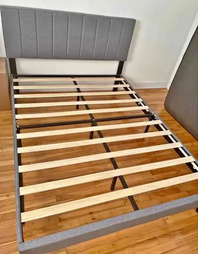 This is a Queen Size Gray Upholstered Platform Bed Frame. This bed frame is in used condition, but h...