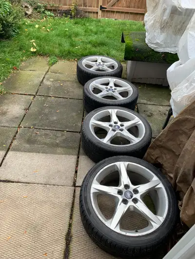 Full set (4 each) of Ford OEM 5 spoke aluminum rims shod with Hankook Winter i*cept evo 235/40 R18 t...