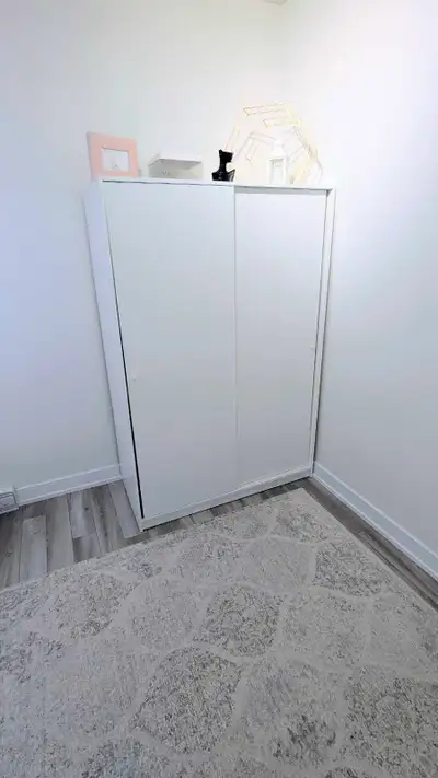 I'm selling a used IKEA wardrobe. It's a great storage solution with a clean, white finish and doubl...