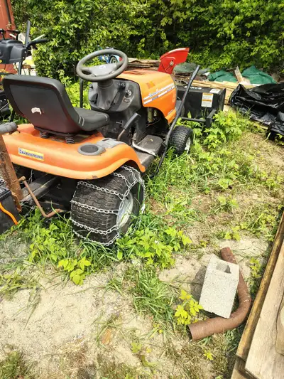 2 “lawn” tractors for sale first one is a husqvarna yth 2242 hydrostatic with attached snowblower no...