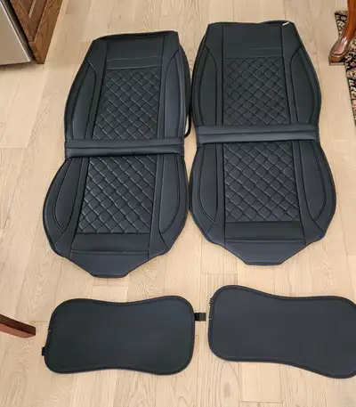 FULL SET OF HEAVY FAUX LEATHER SEAT COVERS. NEVER INSTALLED. BOUGHT AT AUCTION ONLY TO FIND THEY DON...
