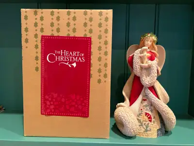 The Heart of Christmas Angel with Star Figurine. Like new condition. No marks on the paint and no ch...