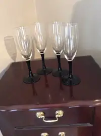 4 black stemmed wine glasses