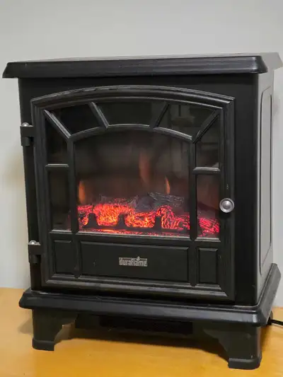 Foyer DuraFlamme qui reproduit l'effet du feu et qui chauffe à l'électricité. payé 423$+tx neuf