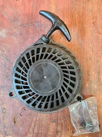 This is a used MTD Original Recoil Starter Assembly, also known as a pull start, designed for MTD, Y...