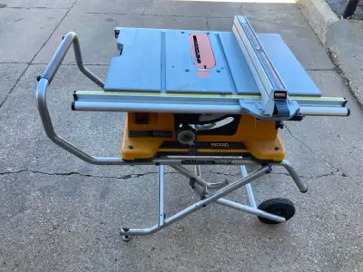 RIDGID 10" TABLESAW WITH WHEELED STAND AND ACCESSORIES, View more