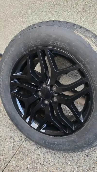 Selling a set of four 245/60/R18 winter tires mounted on black rims. Lots of tread left and in good...