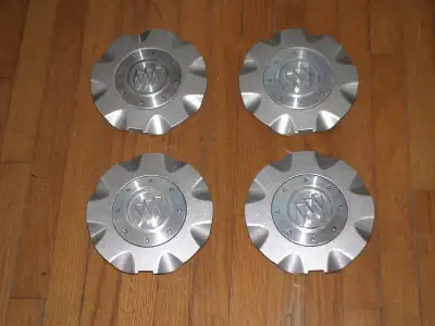 Four center caps for Buick Allure 2005-2009. Excellent condition