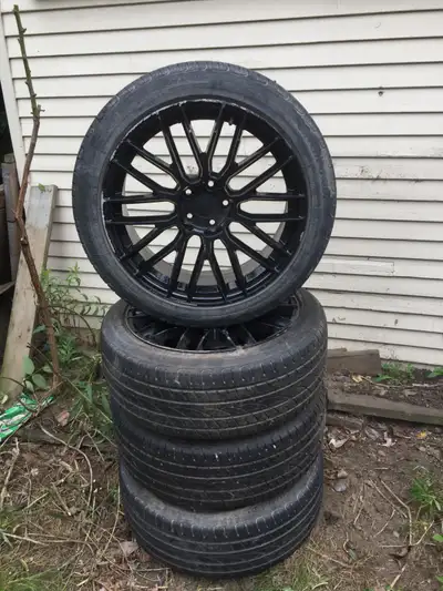 Aftermarket (Non Branded) black alloy 5 lug rims 5X115, still lots of life in the tires