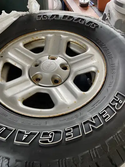 5 jeep tires. Decent shape 1 brand new spare. Jeep JK 5x5" spacing 5x127mm