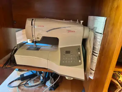 Singer Futera CE 200 Sewing machine used at most 6 times Never used embroidery function Few more att...