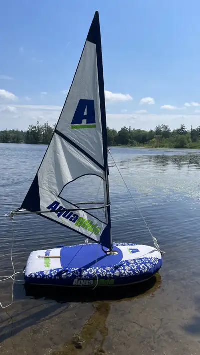 In great condition, with paddles and all sailing components The Multisport inflatable converts in se...