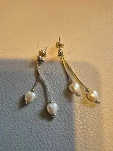 Ear rings, delicate pearl hanging on gold coloured chain, View more
