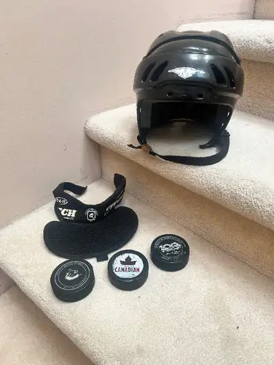 Hockey helmet M $20, Neck guard $10, Pucks 3 for $10, View more