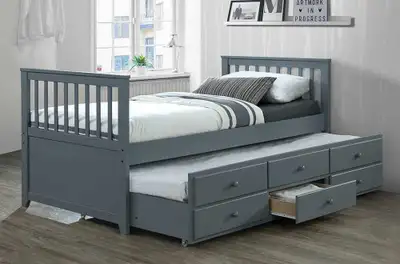 This is a charming, used grey twin-size platform bed with a pull-out trundle, perfect for accommodat...