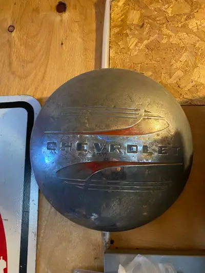 Chevrolet hub cap from approximately 1940s truck. July 2023 magazine. $10 Located in Lorette