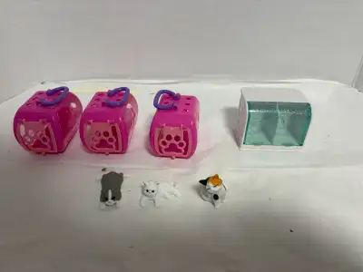 This Littlest Pet Shop bundle includes three pink pet carriers, one habitat, and three cat figurines...