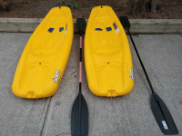 Two kid's sit on top kayaks with paddles