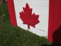 3 Hand crafted solid wood Canadian flags. Red is raised.