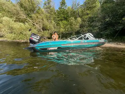 150hp plus trolling motor, never made into the water this year. No time. May also trade for a 2014-2...
