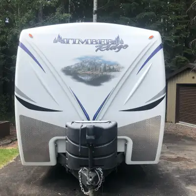 4/season, half ton towable two door unit. Power stabilizers, front hitch, awning and large slide. Fr...
