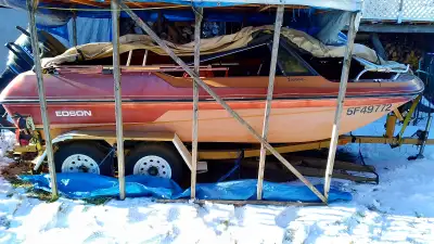 fiberglass trihull on two axle trailer. rear axle has electric brakes.