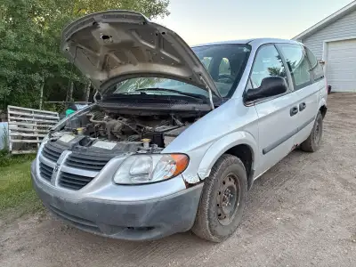 2007 Dodge Caravan. It runs but needs some work. Tires like new battery new. Good parts van