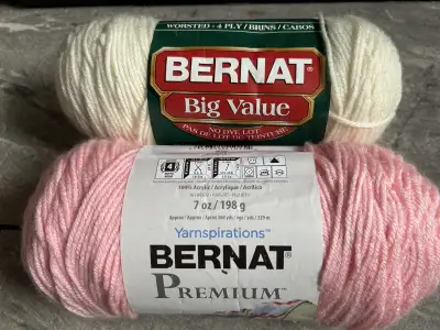 These are two new rolls of Bernat wool, perfect for knitting projects. One is Bernat Big Value in cr...