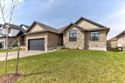 Welcome to this beautifully crafted 3+1 bedroom, 3-bathroom bungalow, custom-built in 2022 by a trus...