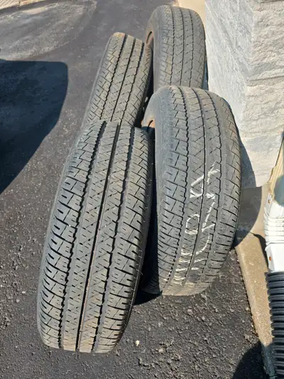 Lightly used Firestone FR-710 winter tires on steel rims for a 2015 Nissan Micra.
