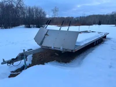 Approx 30’ of usable deck space. I believe total trailer length is 35’. Will fit 6 snowmobiles, we w...