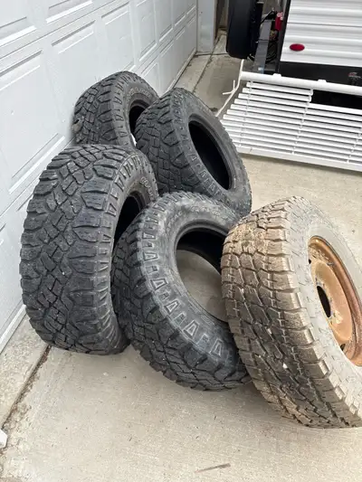 4 used Goodyear Wrangler tires 285/70 R17, roughly 3/8” tread left. one (brand new) Nito Terra grapp...