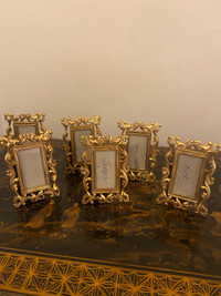 Set of 6 miniature gold tone heavy metal frames. 3.5”x2.5”. 