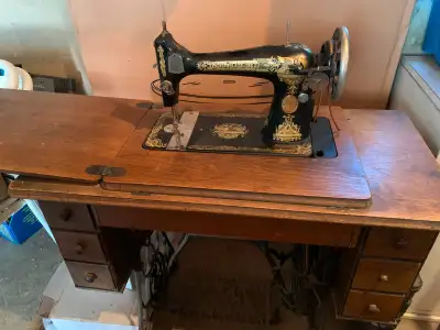 Antique Singer treadle sewing machine, View more