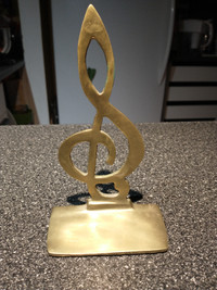 Musical note solid brass bookend.
