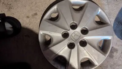15 inch steel l rims and hubcaps yours for $40 for all 4. 20565r15 is the tire that was on them. do...