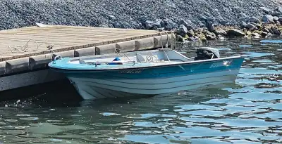 14ft Fiberglass with 9.5hp Johnson & Trailer