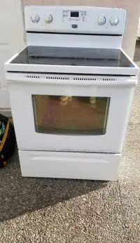 Two Maytag glass top stoves 