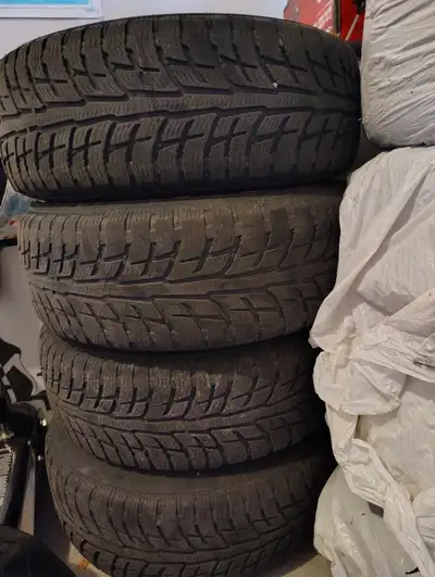 Set of 4 BFGoodrich Winter Slalom winter tires mounted on steel rims. Size: 225/65R16 100T Bolt patt...