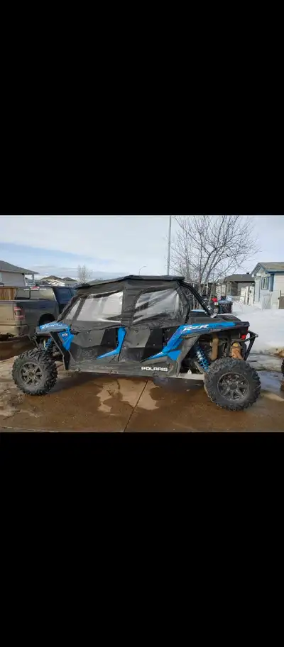 Selling 2015 Polaris RZR XP4 1000 Machine has 4,242 km on it. Has Full enclosure with metal lower do...