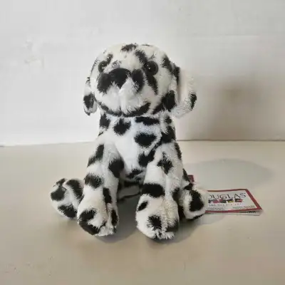 This charming stuffed animal features a soft, fluffy texture with a classic black and white spotted...