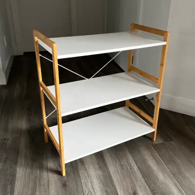 A Three Tier Shelf. White Shelves, Natural Wood Frame, Metal Support Beams In The Back. In Good Cond...