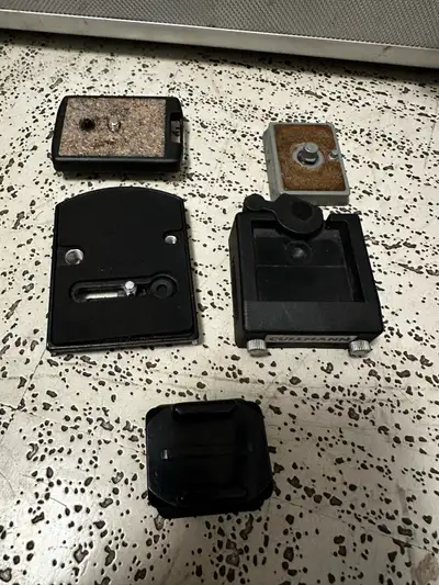 I'm selling a collection of tripod quick release plates. These are used but in good working conditio...