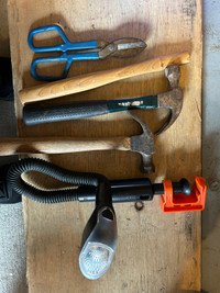 Collection of hammers, tin snips and clamp on work light