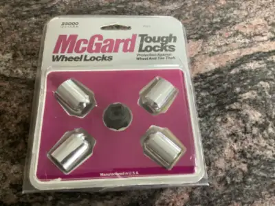 Set of 4 with key of McGard tough locks in open box. Model: 2500 ( 12 x 1.5 R.H. ) in almost new con...